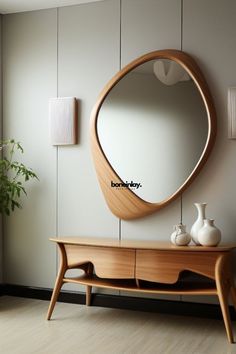 a wooden table and mirror in a room