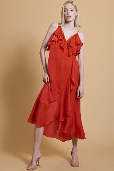 Meet our most enchanting dress yet - Our Red Wrap ruffle dress is cut to a flattering shape with adjustable spaghetti straps. An undeniable style for romantic evenings and elegant events, this dress is the perfect style to sculpt and enhance your shape.  20% silk 80% viscose