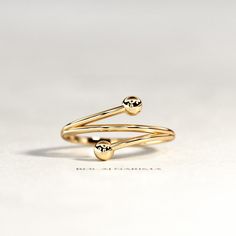 Bypass Gold Ring / 14K Yellow Gold Ball Ring / Bypass Ball Ring / Open Beaded Ring / Gold Open Ring / 14K Gold Spiral Ring ▶ Watch Ring In 360o >> http://bit.ly/BN131 ★ Details : ✔ Shank Width 1.3 mm ✔ Total Width 11.5 mm (bead to bead) ✔ Metal 14K / 18K Solid Gold ✔ Gold Color Yellow / White / Rose ✔ Ring US Size 3-11 / Contact me for other ★ Features : ✔ Handmade & Made to order. ✔ Ready to ship in 6-10 Business days. ✔ Complimentary gift wrapping. ✔ Free insured worldwide shipping. Small Diamond Rings, Bezel Set Diamond Ring, Dainty Diamond Ring, Spiral Ring, Womens Ring, Womens Rings Fashion, Beaded Ring, Bypass Ring, Ringe Gold