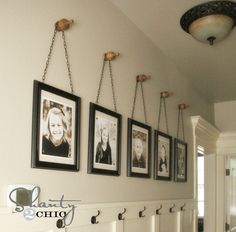 a bathroom with pictures hanging on the wall