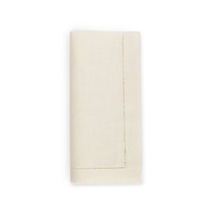 the linen napkin in white with gold thread