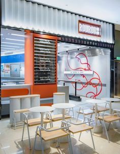 the inside of a restaurant with tables and chairs