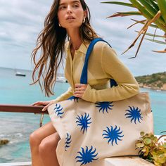 Be the ultimate goddess with BURGA's Beach Bag. Imagine strutting down the beach, bag in hand, catching everyone's eye with its vibrant patterns and luxe look. It's roomy enough to fit all your essentials (and then some), but sleek enough to make a fashion statement. Whether you're hitting up a tropical paradise or just lounging by the pool, this bag screams style, sass, and totally you.    Features:     Dimensions: 50 x 11 x 35 cm (19.7 x 4.4 x 13.8 inches)     Made from durable canvas: 35% cotton and 65% polyester.     Secured with magnetic fasteners.     Interior pocket for phone, keys, and small items.     Spacious design for all your essentials.     Part of our exclusive Resort Collection.     Care Instructions:     Spot clean with mild soap and water.     Hand wash with cold water an Sand-colored Shoulder Bag For Summer Travel, Sand-colored Travel Bags For Beach Season, Summer Canvas Bag With Double Handle, Summer Beach Tote Bag With Removable Pouch, Summer Beach Bag With Removable Pouch And Double Handle, Summer Beach Bag With Double Handle And Removable Pouch, Vacation Day-out Shoulder Bag With Adjustable Strap, Vacation Shoulder Bag With Adjustable Strap For Day Out, Chic Summer Beach Canvas Bag