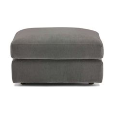 the footstool is made from grey fabric