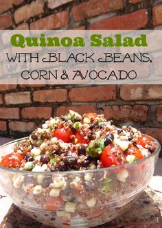 quinoa salad with black beans, corn and avocado in a glass bowl