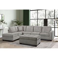 The 186" Wide Right Hand Facing Corner Sectional with Ottoman is an attractive and stylish piece of furniture that adds a modern touch to any room. The sectional is made from high-quality, durable fabric upholstery, and it comes with a reversible chaise and a matching ottoman. The sectional is comfortable and inviting, and the reversible chaise allows for multiple configurations and seating arrangements. The ottoman provides additional seating and storage, making it perfect for small spaces or a Matching Ottoman, Gray Sectional, Sectional With Ottoman, Upholstered Sectional, Corner Sectional, Living Room Sectional, Reclining Sectional, Fabric Upholstery, Extra Seating