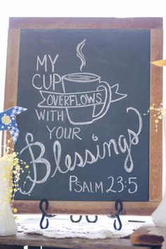 a chalkboard with the words my cup overflows with your blessing