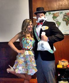 a man and woman dressed up in costumes posing for the camera with money bags on their feet