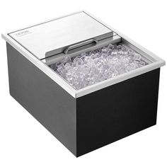 an ice chest is shown with the lid open and ice in it's bottom compartment