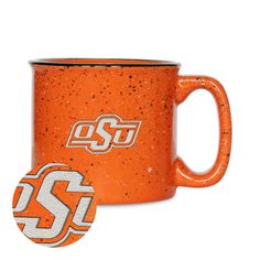 an orange coffee mug with the word ss on it