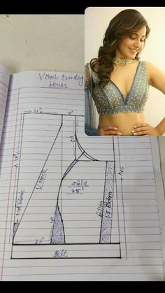 an open notebook with a drawing of a woman's top and measurements on it