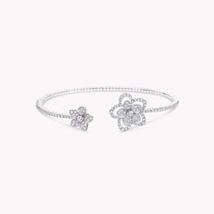 Two contrasting diamond flowers blossom side by side upon our Wild Flower bracelet, distinct yet complementary. Bursting with life, the flowers are connected by a delicate, beautifully articulated row of diamonds and realised with a wild touch that is unique down to every petal. Updating the traditional English Garden with carefree charm and a contemporary spirit, four varieties of flower flourish in rare abundance in our Wild Flower garden, inspiring you to mix, match and make everyday diamonds Graff Bracelet, Traditional English Garden, Wild Flower Garden, Graff Jewelry, Diamond Shaped Engagement Ring, Bangle Diamond