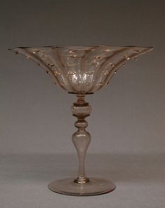 a clear glass vase sitting on top of a table