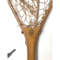 an old tennis racquet that has some kind of net on it