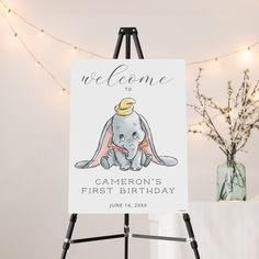 a welcome sign for a baby shower with an elephant