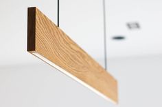 a wooden object hanging from the ceiling in a room