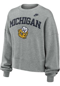 Make your way to the big game in this Michigan WolverinesWomens Grey Essential Crew Sweatshirt! This Wolverines Long Sleeve Sweatshirt features a screen print team logo on center chest. Stay warm and comfortable with this Womens Michigan Wolverines Crew Sweatshirt. Made of 82% cotton / 18% polyester, Drop shoulder, Ribbed cuffs, Ribbed hem, Straight hem, Machine wash cold, tumble dry low, 82% COTTON / 18% POLYESTER, 4 Michigan M, Minnesota United Fc, New York City Fc, Vancouver Whitecaps Fc, Nba Hats, Sporting Kansas City, Nike Sweater, Michigan Wolverines, Nike Womens