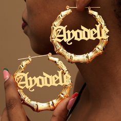 Custom Old English Bamboo Earrings: Make a bold statement with our personalized earrings featuring gothic font nameplates. These big bamboo hoops are a stylish way to showcase your unique identity. Elevate your style with our striking personalized earrings, boasting intricate gothic font nameplates. Crafted with attention to detail, these big bamboo hoops are not just accessories but statements of individuality. Wear them confidently, knowing they are customized to reflect your unique persona. T Big Hoop Earrings Black Women, Boy Jewelry, Big Bamboo, Personalized Earrings, Gothic Font, Earrings Gothic, Bamboo Hoop Earrings, Gothic Fonts, Tooth Gem