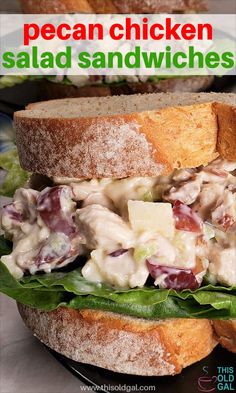 a chicken salad sandwich with lettuce and cheese on it is sitting on a plate