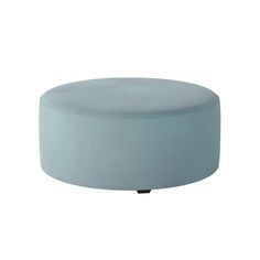 a blue ottoman sitting on top of a white floor