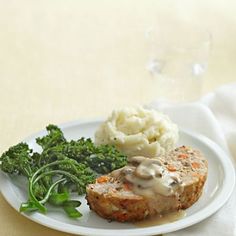 meatloaf with gravy, mashed potatoes and broccoli on a plate