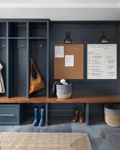 a wooden bench sitting in front of a locker with shoes on top of it and a cork board attached to the wall