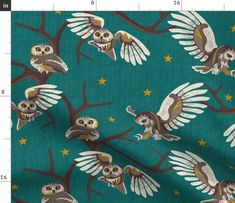 an owl and stars pattern on a teal green background, with the measurements for the fabric