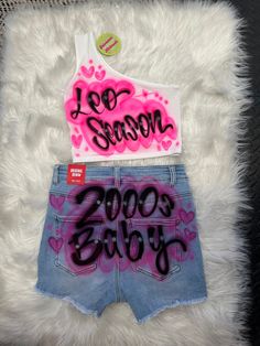 Airbrush Designs by Galveston Airbrush! ♡ ✧ Our Designs on these cute Crop tops and shorts are handmade with the artists' skilled Hands. The ✧Design might look slightly different from the pictures or have small imperfections and that's okay, it's what makes them unique Each design includes up to TWO names or words with up to THREE specified COLORS. Please leave all the design instructions in the personalization section of your order. SIZES: Available for ADULTS DESIGN PLACEMENT: All designs are airbrushed on the FRONT of our crop top and on the back of the shorts, unless specified otherwise. Get more design ideas from our TikTok at @galvestonairbrush and Instagram at @Galveston_Airbrush. Follow your order process on our Insta Stories.  International orders may have an additional shipping c Y2k Airbrush Outfit, Freaknik Shorts Ideas, Spray Paint Birthday Outfit, Airbrush Outfits Birthday, Airbrushed Birthday Outfits, Airbrush 90s Outfit, Airbrushed Outfits, Early 2000s Outfits Black Women, Pink Graphic Print Shorts For Summer