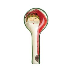 a glass spoon with a santa clause on it's head in the shape of a spoon