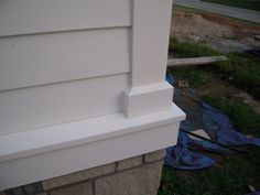 the corner of a house that has been painted white