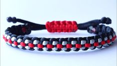 two red, white and black braided bracelets