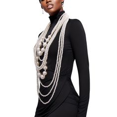 Elevate your style with our Long Gold and Chunky Cream Pearl Multi-Strand Layered Necklace Set – a luxurious fusion of opulence and sophistication. This statement piece boasts an impressive 10 layers of lustrous cream pearls creating a stunning cascade that will captivate onlookers. Features: Pearl Elegance: Adorn yourself with ten layers of exquisite cream pearls, each strand carefully selected for its radiant glow and uniform shape. Chunky Gold Chains: The intertwining with jumbo pearls adds a touch of glamour and modernity, creating a perfect balance between classic and contemporary aesthetics. Versatile Length: The long length of this necklace set offers versatility in styling, allowing you to wear it as a dramatic single strand or double it up for a chic layered look. Secure Clasp: Th Luxury Elegant Oval Beaded Necklaces, Luxury Single Strand Elegant Beaded Necklaces, Luxury Statement Necklace With Large Stone, Luxury Ceremonial Jewelry With Large Beads, Luxury Bohemian Double Strand Beaded Necklace, Outfits With Pearl Necklace Classy, Long Pearl Necklace Outfit, Styling Pearls, Necklace Styling