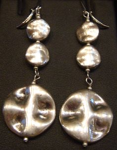 These earrings are light weight. The disks are high quality pewter connected with sterling silver eye and head pins. The Lever back ear wires are also Pewter. length is 3 inches and widest disk is 1 inch wide.  Free shipping on orders totaling $35 or more. Aggregate, multiple item,  orders of $35 or more will be given free shipping at check out! Happy shopping.  Free shipping only to addresses inside USA, including AK, PR and Hawaii Silver Eye, Head Pins, Pierced Earrings, Earings Piercings, Ear Wires, Jewelry Earrings Dangle, Etsy Earrings, Dangle Drop Earrings, Happy Shopping