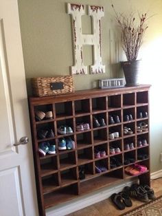 an old shoe rack has been converted into a shoe storage unit