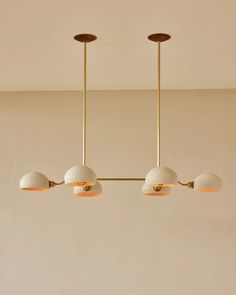 three lights hanging from the ceiling in a room