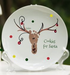 a white plate with a reindeer's handprint on it