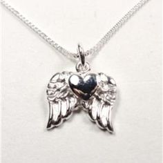 Let Your Heart Take Flight With This Adorable Floating Heart Soaring Heavenly Angel Wings Sterling Silver Necklace That Comes With A .925 Sterling Silver 20 Inch Box Chain And The Floating Heart Soaring Angel Wings .925 Sterling Silver Pendant. The Beautifully Detailed Floating Heart Soaring Angel Wings Pendant Is Approximately 12mm (.47in) Wide And 15mm (.59in) High And Features A Separate Floating Heart On Top Of The Wings. The Chain Measures 20 Inches And Weighs 2.2g. Cn 1-0281 Angel Wings Pendant, Wings Pendant, Angel Wings Heart, Angel Wing Necklace, Angel Wing Pendant, Nautical Jewelry, Angels In Heaven, Wing Necklace, Sparkle Jewelry