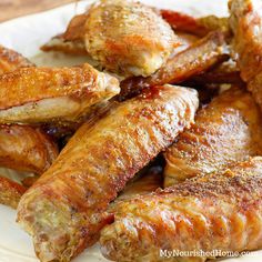 some chicken wings on a white plate