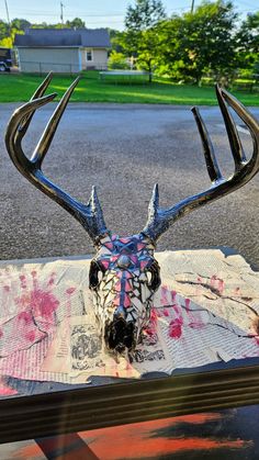 a deer's head is sitting on top of a table