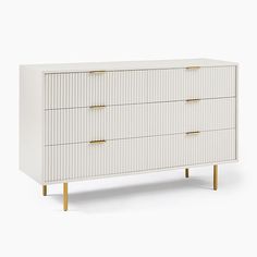 a white dresser with gold handles and drawers on it's sides, against a white background