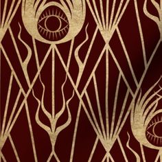 a red and gold wallpaper with art deco design