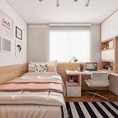 a bedroom with a bed, desk and chair in it