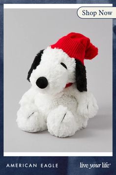 a white stuffed dog with a red hat on it's head and the caption american eagle live your life