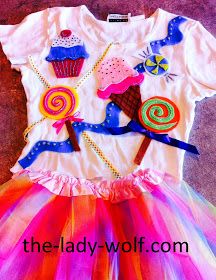 a white shirt with cupcakes on it and colorful tulle skirt