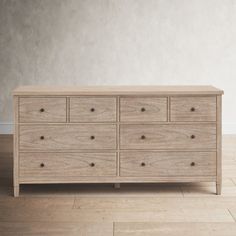 a large wooden dresser sitting on top of a hard wood floor next to a white wall