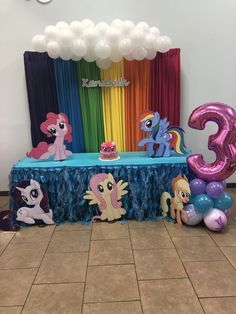 an image of a birthday party setting with my little pony decorations and balloons on the floor