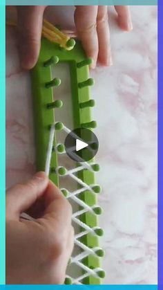 someone is working on an object made out of legos and stringing it with scissors