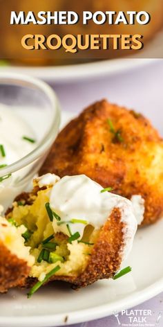 mashed potato croquettes on a plate with sour cream in the middle