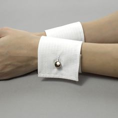 Decorative detachable shirt cuffs will help you to complete your unique look. It is possible to wear them with a jacket, uniform, dress, or sweater. Or you could wear them with a T-shirt. Be special, and create your own unique style! Please find out the length of your wrist to choose the right size. You may order exactly your size or a larger one if you want the cuff not to be tight. Before ordering, watch my video on the channel on how to measure your wrist. This is necessary so that you choose the correct cuff size. These sizes are only suitable for my store https://www.youtube.com/watch?v=ez5bpwRrkLA Cuffs is produced from 100% cotton. Sizes: Width: 7 cm / 2.8 inches The size is based on your wrist circumference. The size is the length of the cuffs band. Please measure your wrist. Pleas Shirt Cuff Pattern, Elegant Formal Cuff Bracelet, Classic Open Cuff Bracelet For Formal Occasions, Adjustable Open Cuff Bracelet For Formal Occasions, Elegant White Cuff Bracelet, Formal White Cuff Bracelet, White Formal Cuff Bracelet, Adjustable Cuff Bracelet For Formal Occasions, Cuffs On Sleeves