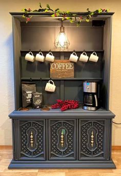 the coffee bar is decorated with flowers and cups